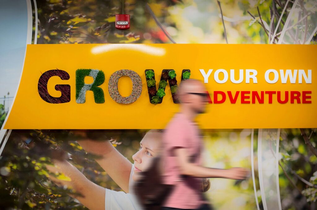 Environmental design for ISU's Department of Horticulture, featuring wall graphics and a 3D sign declaring, "Grow your own adventure."