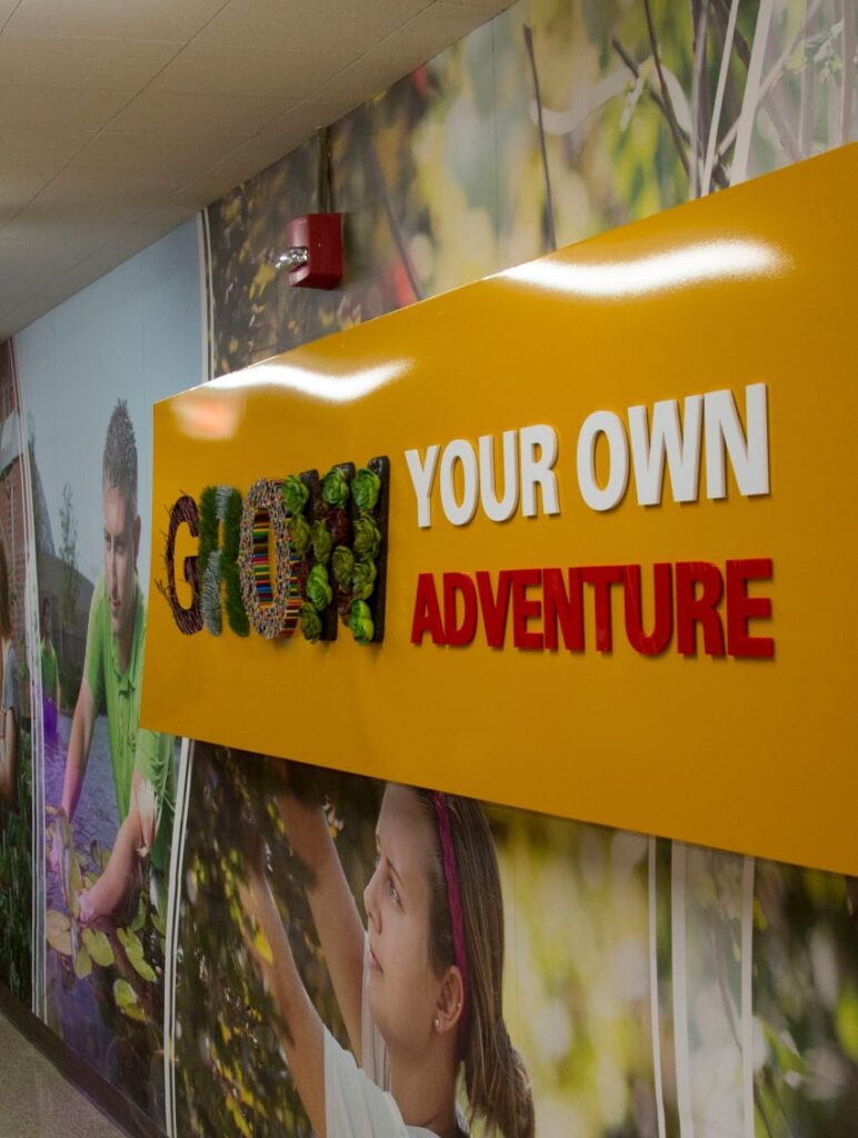 Additional angle of the "Grow your own adventure" sign in ISU's Department of Horticulture.