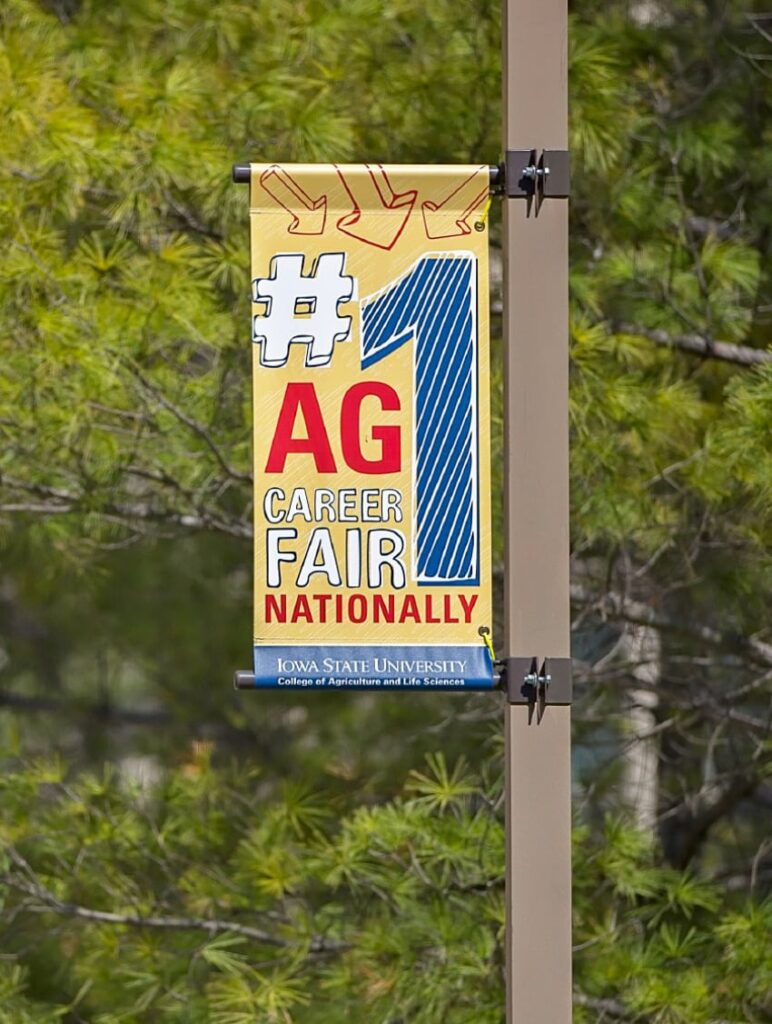 Light post banner designed for ISU's College of Agriculture and Life Sciences, featuring fun typography declaring, "#1 Ag career fair nationally."