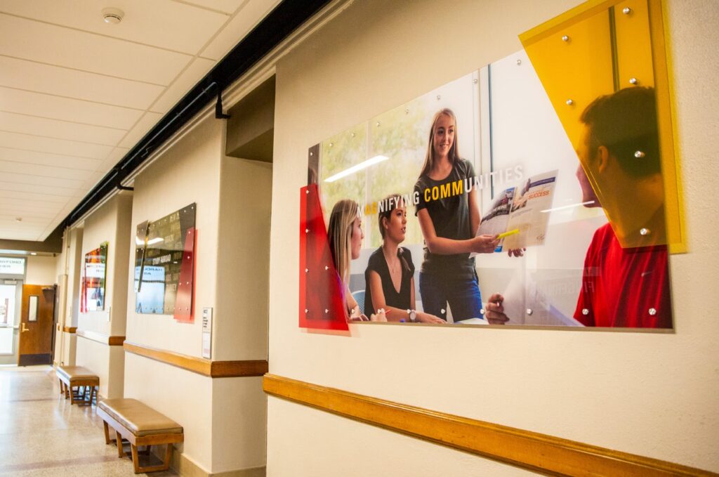 Wall art designed for ISU's Department of Agriculture Education and Studies, featuring photography and typography overlaid with acrylic standoffs.