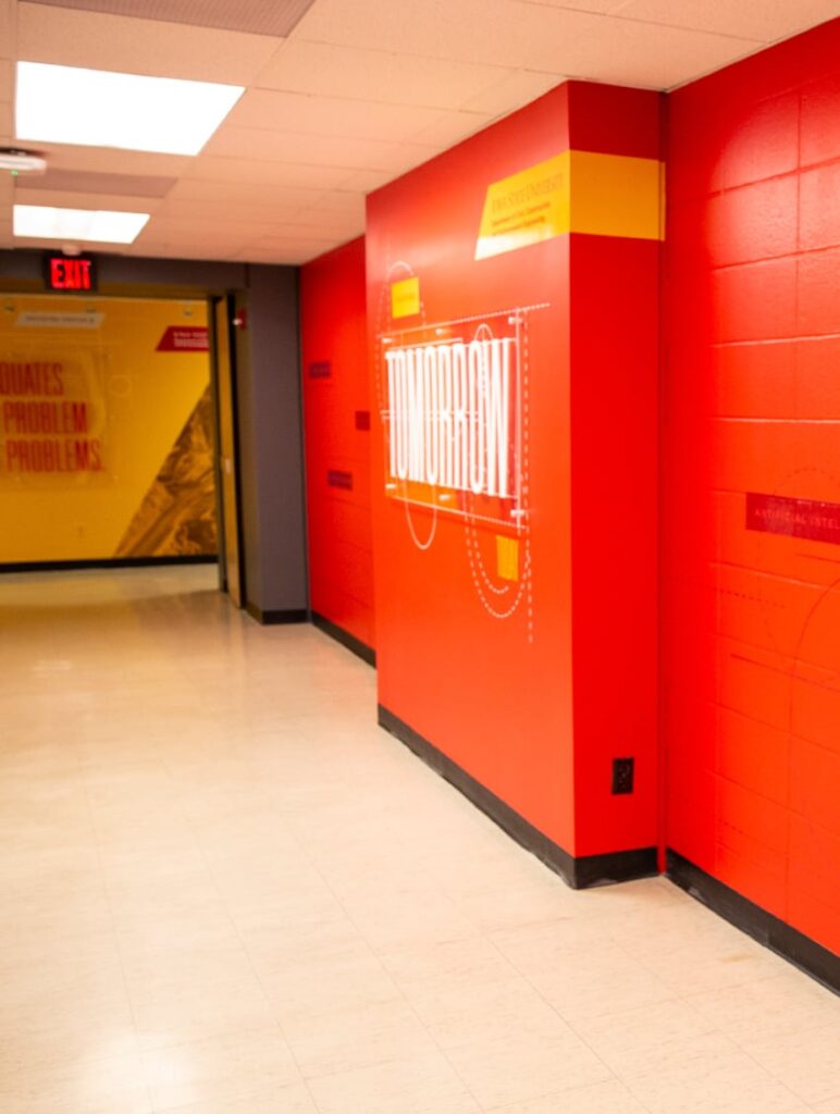 Environmental design for ISU's Department of Civil, Construction and Environmental Engineering, featuring wall graphics and acrylic standoffs with typography.
