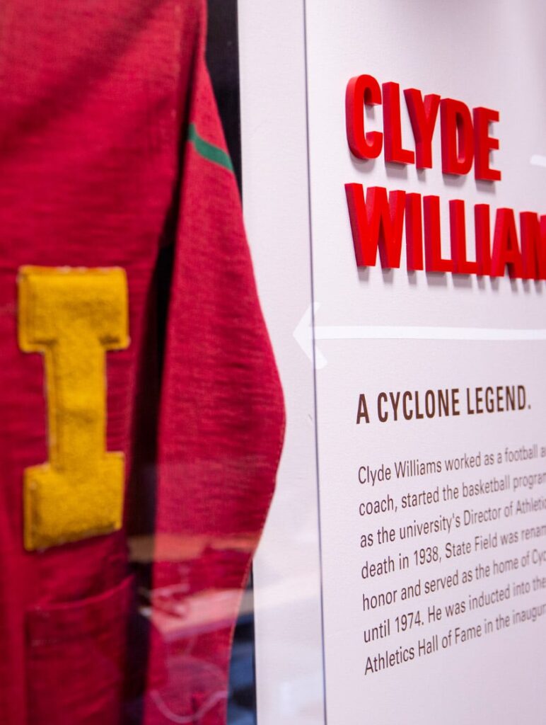 Close-up photo of an acrylic memorabilia case in Clyde's Gastro Diner, featuring the jersey of Clyde Williams.