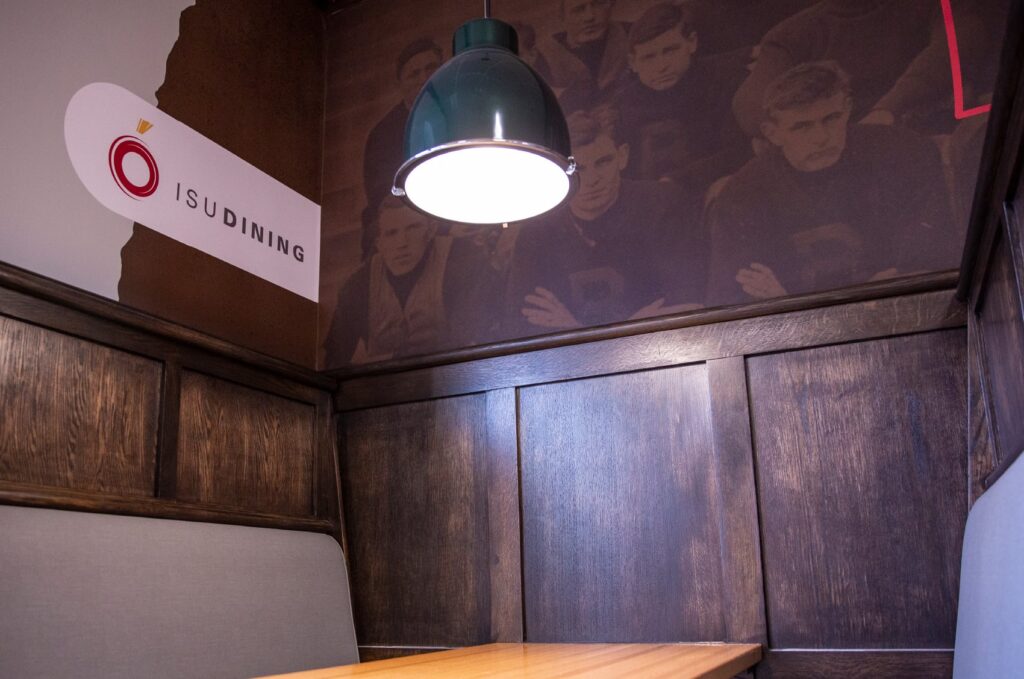 Environmental design for ISU Dining's Clyde's Gastro Diner, featuring wall graphics above a booth.