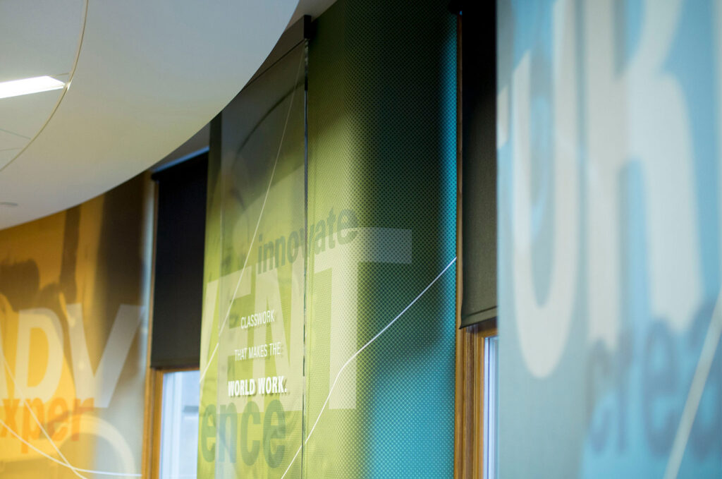 Environmental design for ISU's College of Engineering, featuring floor-to-ceiling graphics wrapped around the walls between windows.