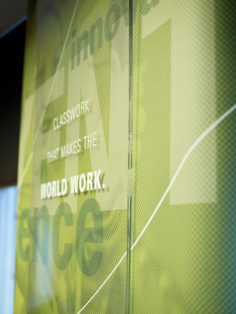Wall graphics designed for ISU's College of Engineering, with typography declaring, "Classwork that makes the world work."