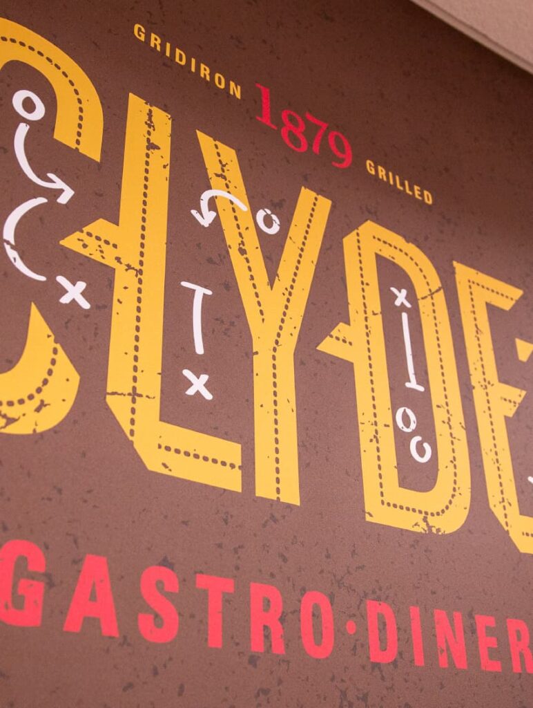 Detailed photo of the Clyde's Gastro Diner logo design and wall graphics.