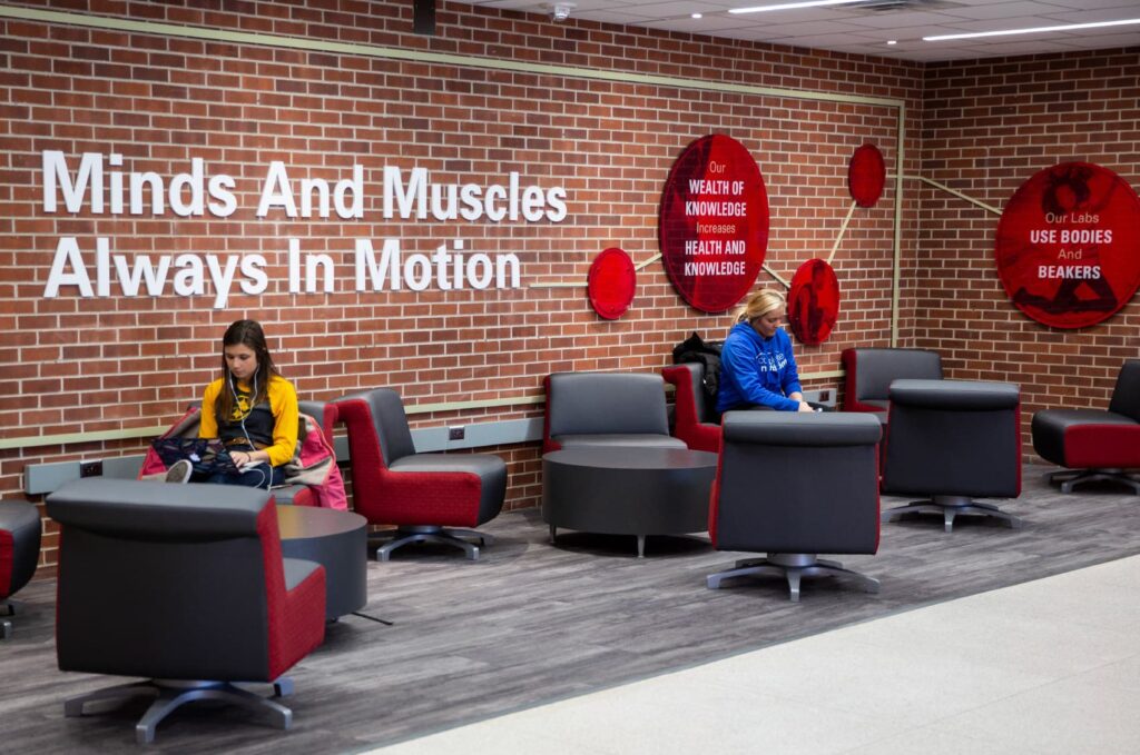 ISU's Department of Kinesiology's environmental design, featuring wall art in a student lounge area.
