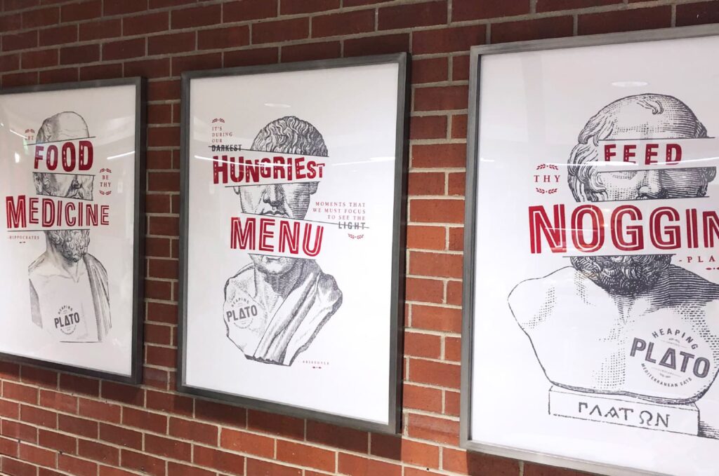 Framed graphics designed for ISU's Heaping Plato Mediterranean Eats, featuring Greek philosophers with graphic typography.