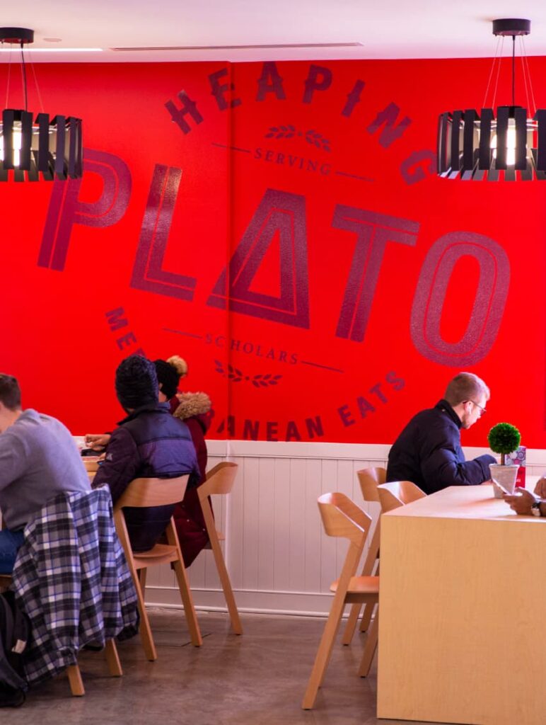ISU's Heaping Plato logo applied as a giant branded graphic to a restaurant wall.
