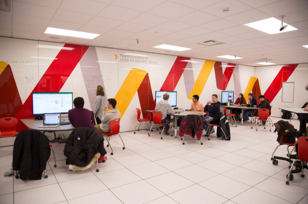 Environmental design in The Mine, a basement lab in ISU's Department of Mechanical Engineering. Bright graphics on dry-erase walls encourage students to brainstorm in a brightly lit space.