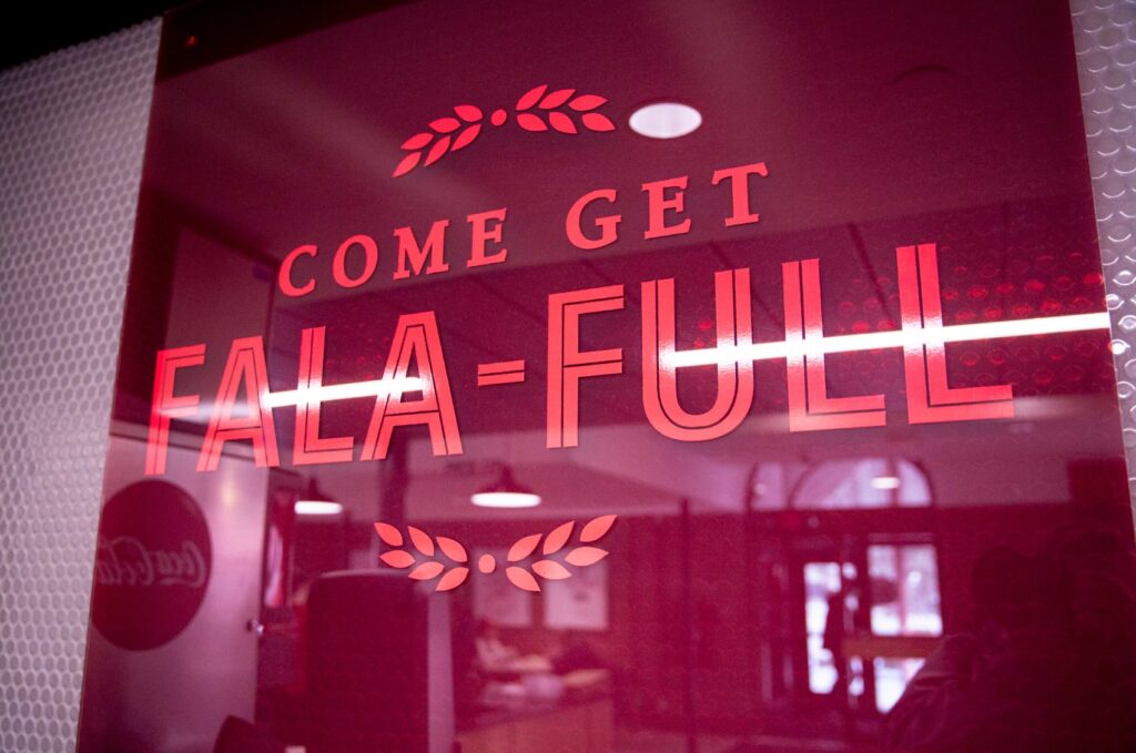 Wall graphic designed for Heaping Plato, with typography declaring, "Come get fala-full."