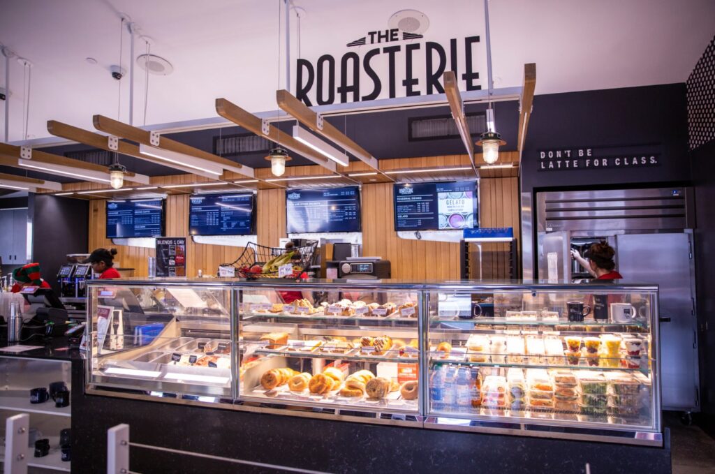 The Roasterie environmental design, featuring airplane design and motifs over the pastry counter.