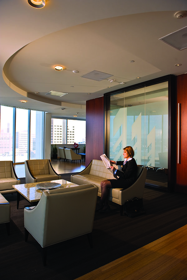 Interior of the Davis Brown Law Firm office, with recessed lighting, frosted windows featuring the logo, and plush conference seating.