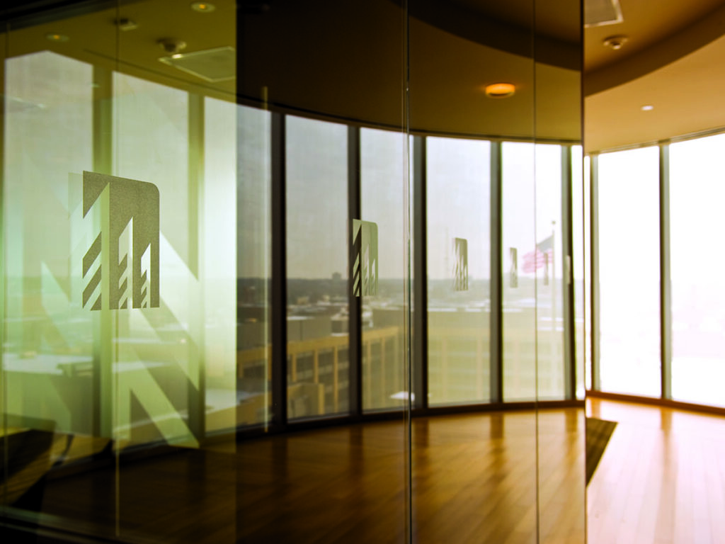 Windows at the Davis Brown Law Firm office, featuring their logo frosted on several panes.