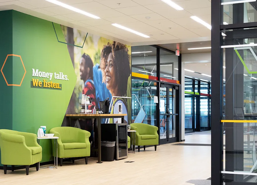 Accent wall in the lobby of Farmer's State Bank, displaying the tagline, "Money talks. We listen."