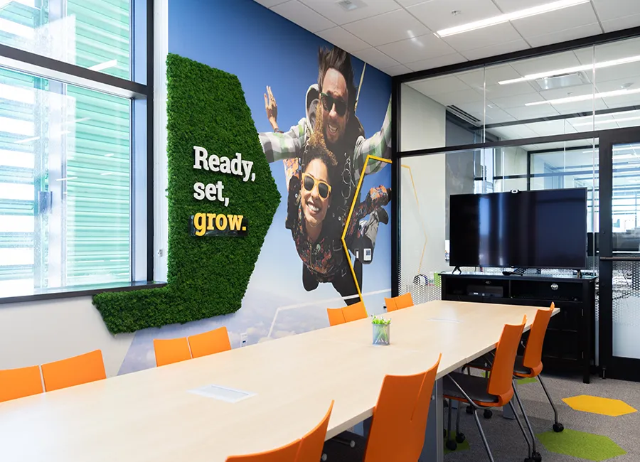 Conference room at Farmer's State Bank, featuring wall decals with the tagline, "Ready, set, grow."